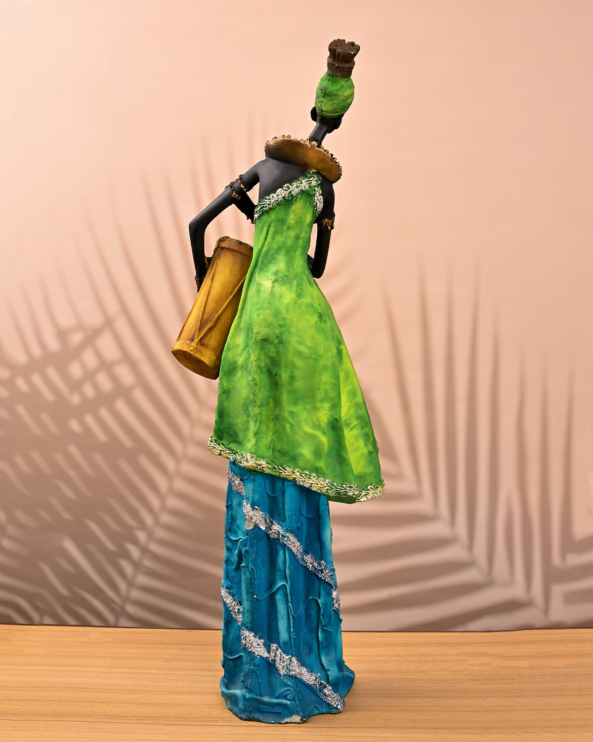 African female musician statue with traditional drum