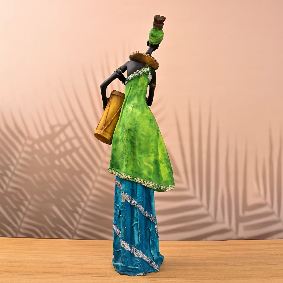 African female musician statue with traditional drum