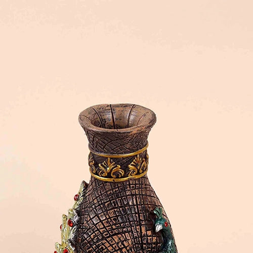 Ornate antique vase with colorful peacock design