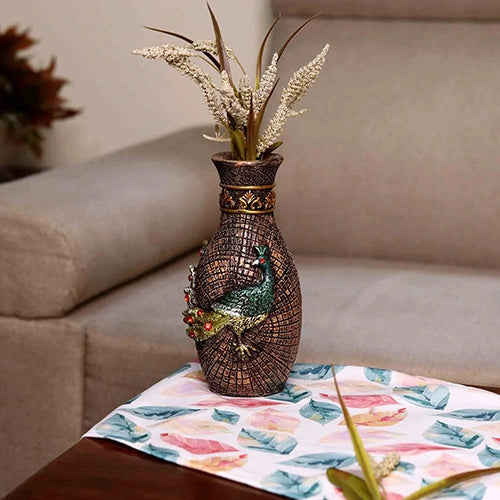 Intricately crafted vase with peacock embellishments