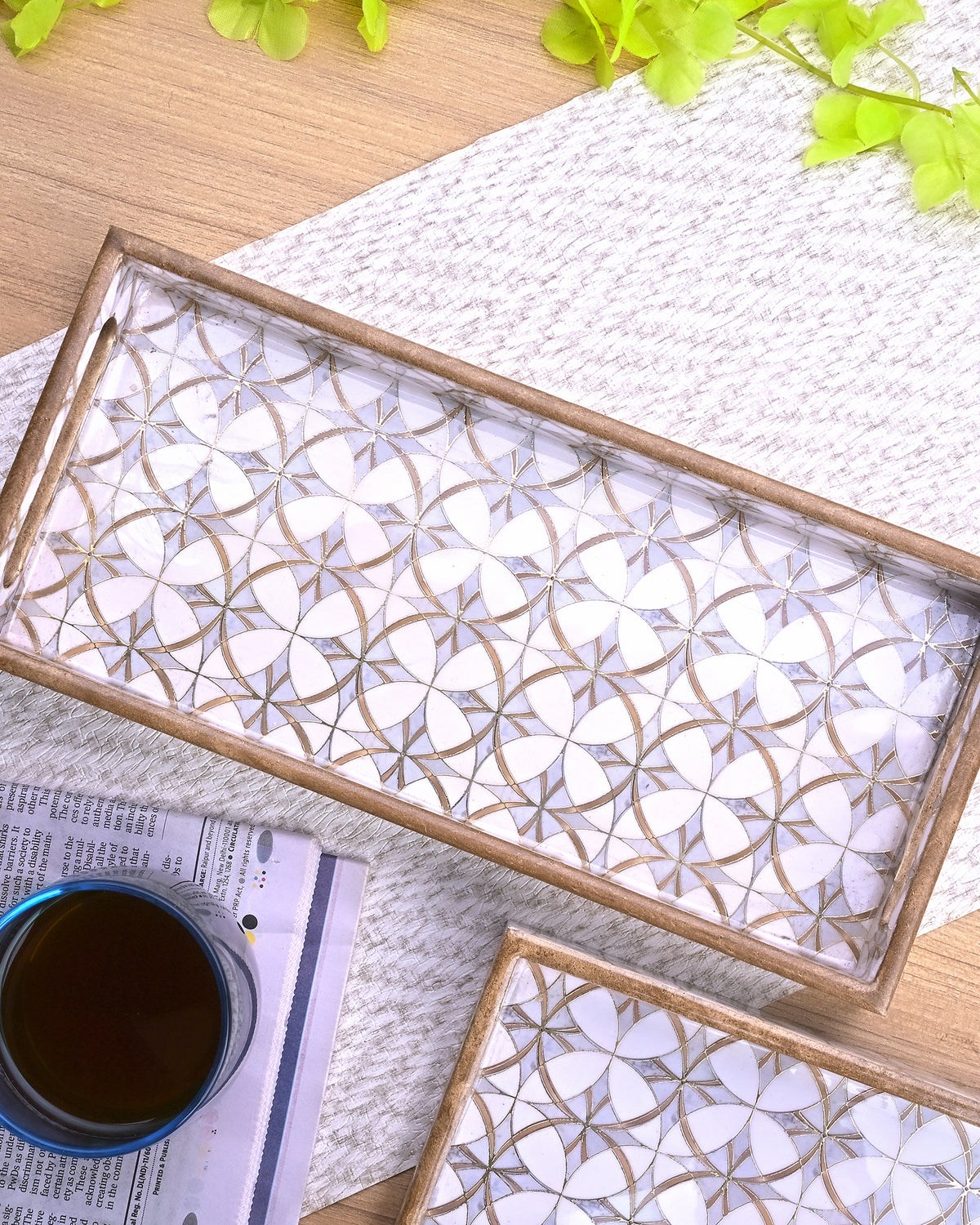 Arabesque patterned serving trays in gold and grey