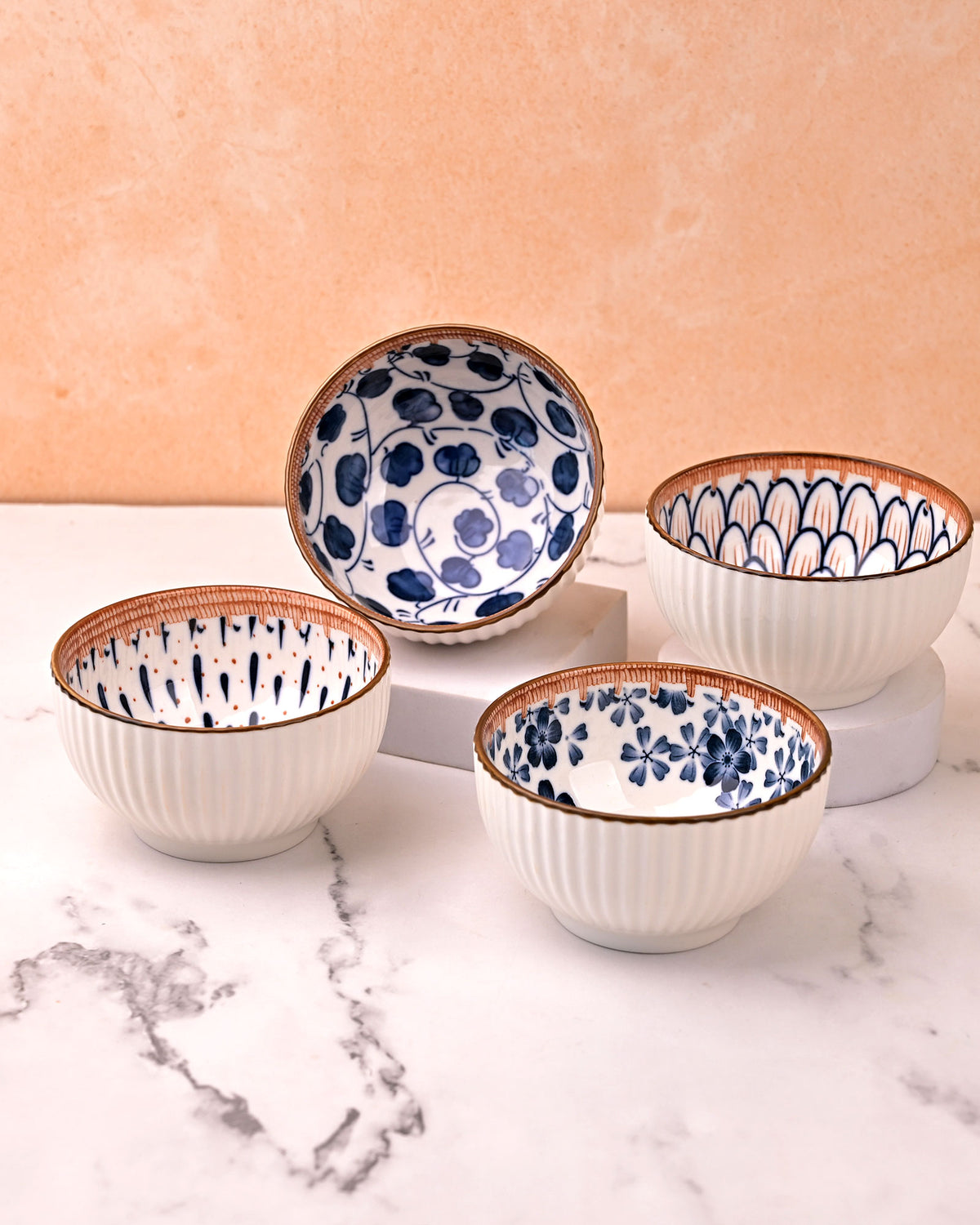 Set of four autumn-inspired porcelain serving bowls