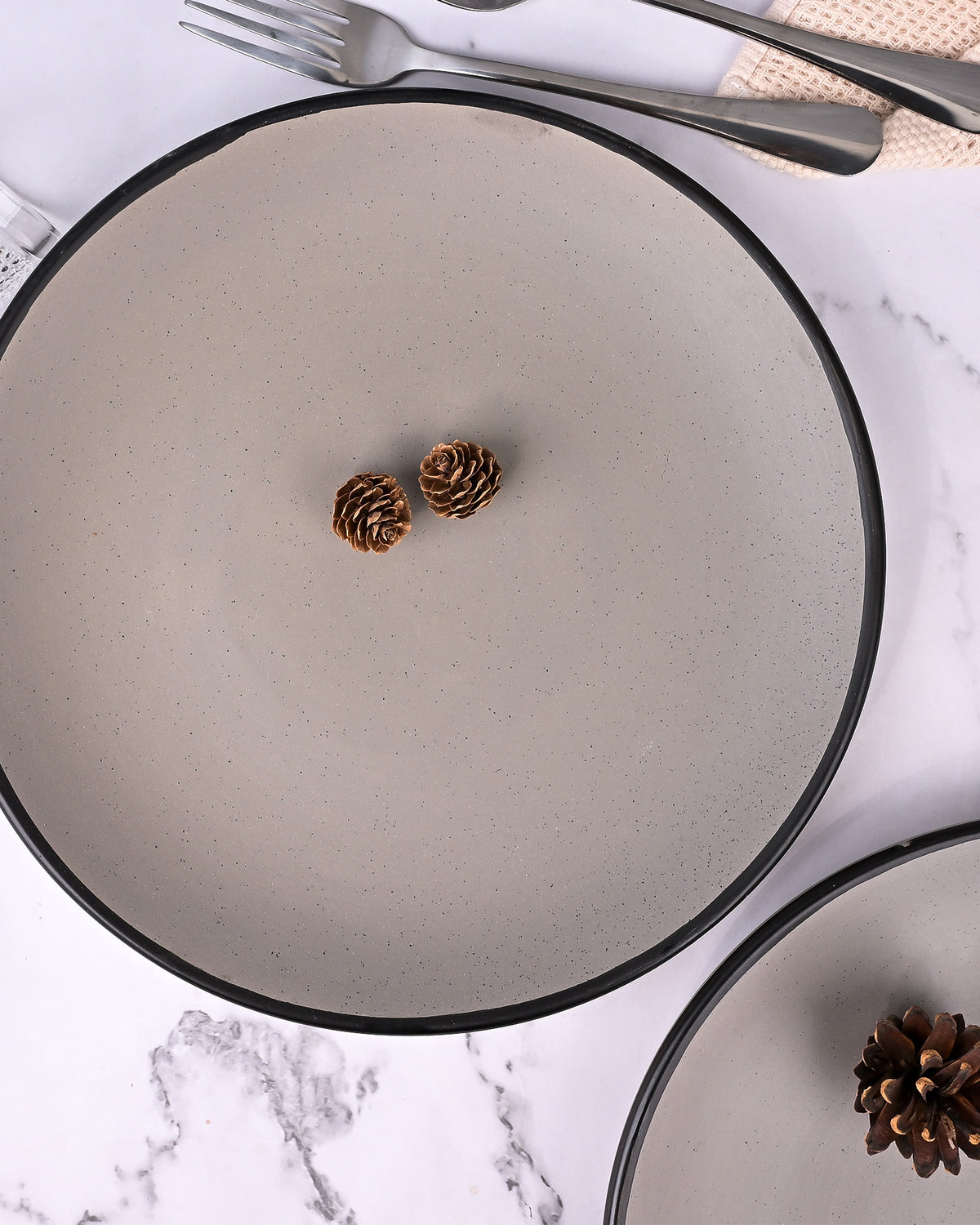 Grey ceramic dinner plates with black border