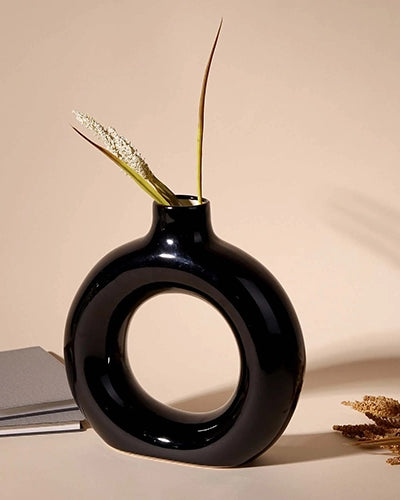 Black donut ring vase with modern sculptural design