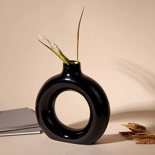 Black donut ring vase with modern sculptural design