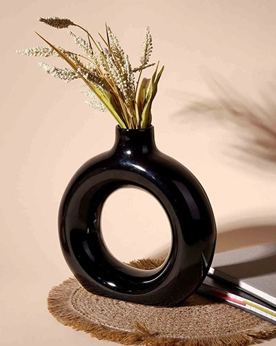 Minimalist black donut-shaped vase with unique design