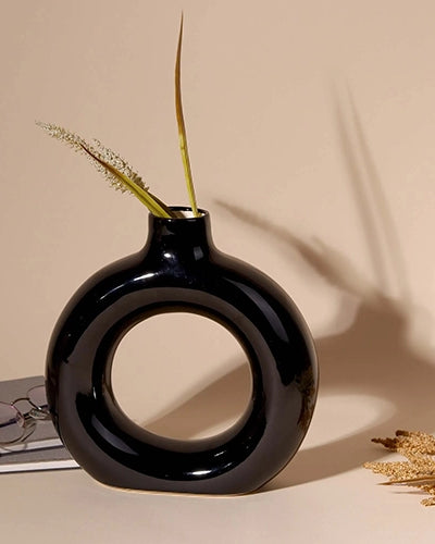 Contemporary black donut vase with a sleek finish