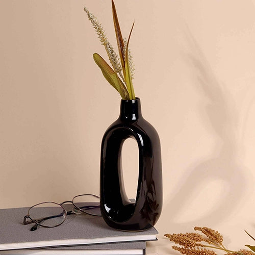 Black hollow minimalist vase with sleek sculptural design