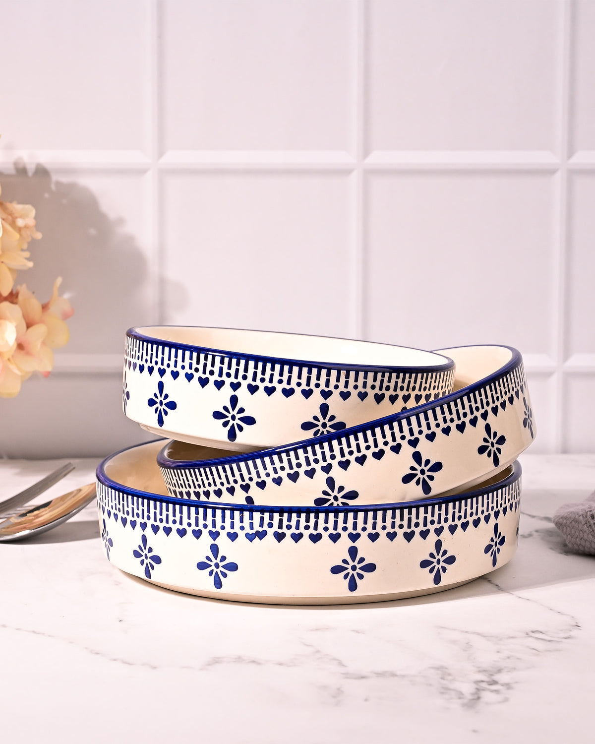 Blue and white serving bowls arranged together