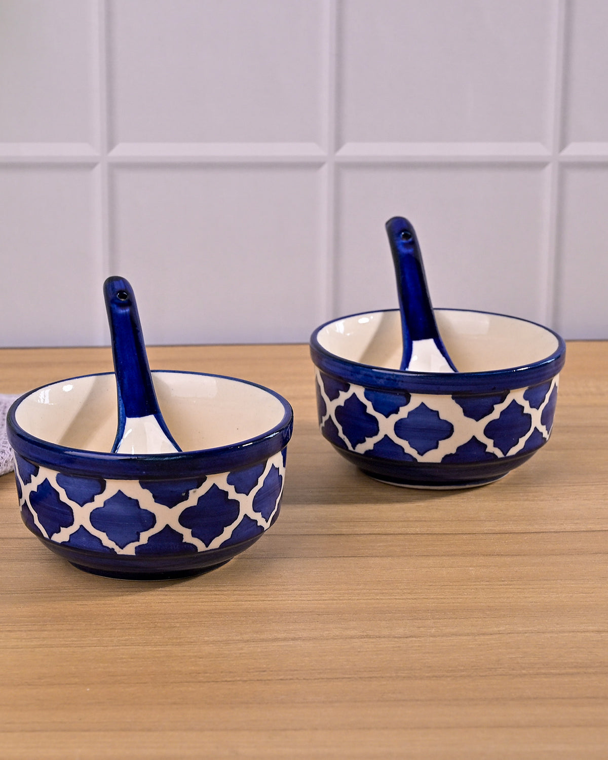 Set of 2 blue porcelain soup bowls with spoons