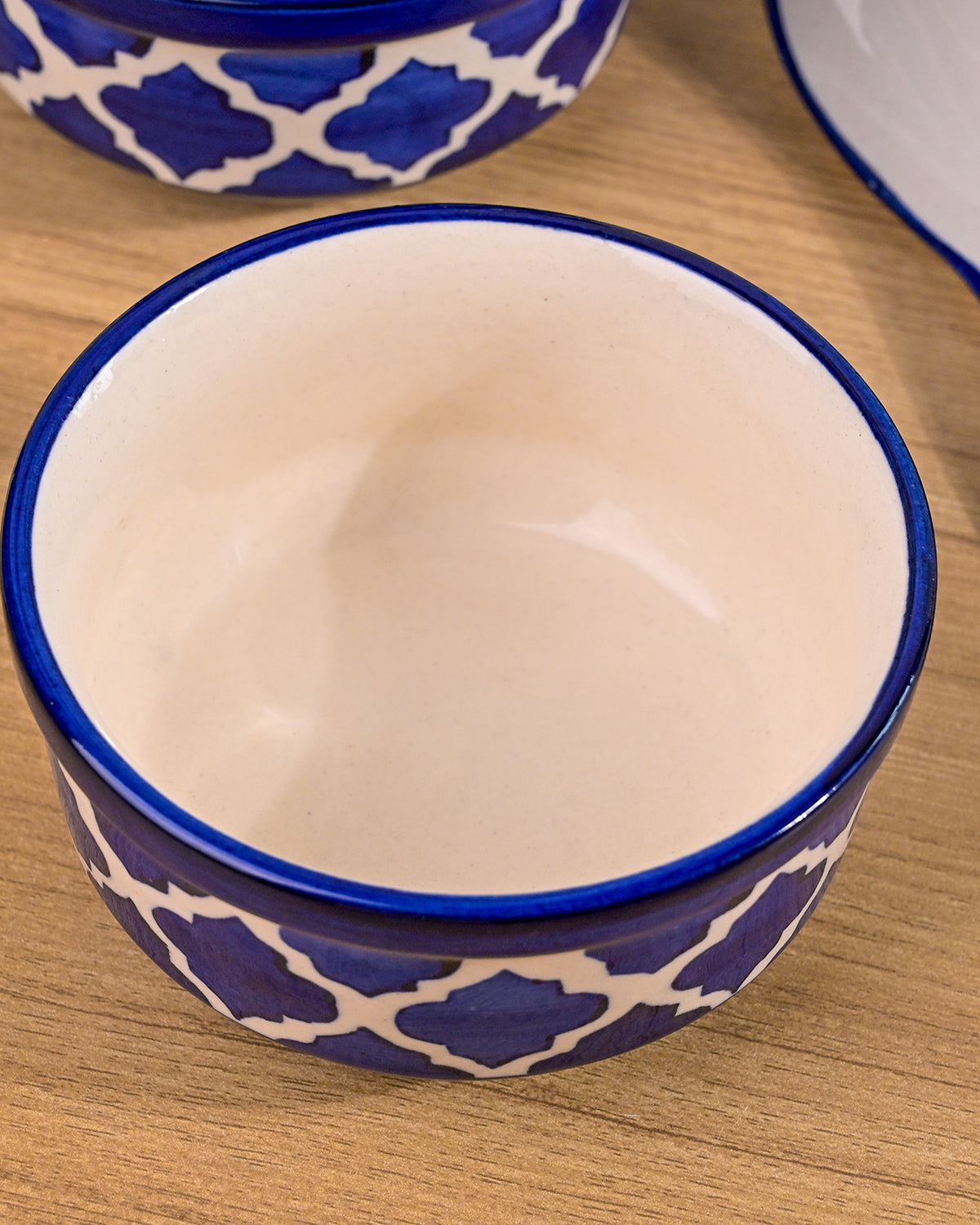 Blue serving bowls with matching spoons for soup