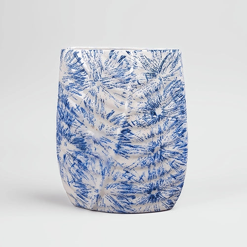 Decorative blue vase featuring a detailed leaf imprint