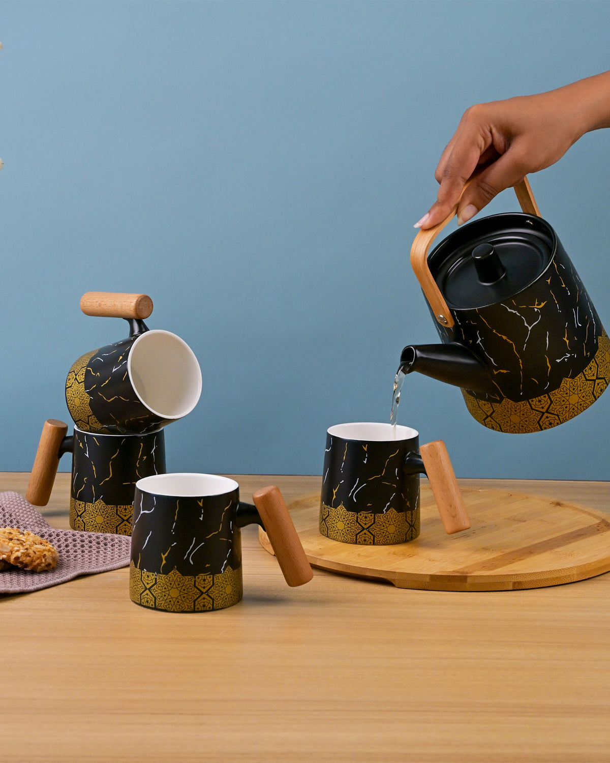 Bronze Decor Black Tea Set Displayed on a Dining Table