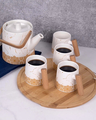 White Tea Set with Bronze Details for Elegant Tea Serving