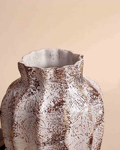 Brown scalloped flower vase with unique surface detailing