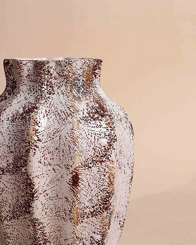Rustic brownish vase with intricate scalloped texture