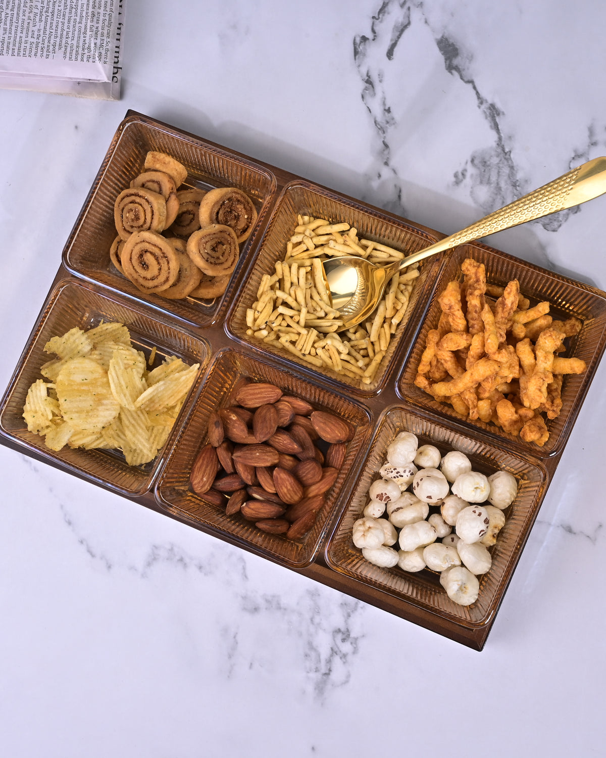 Decorative glass bowl arranged on brown tray