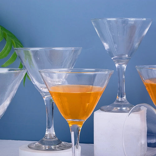 Classic cocktail glasses arranged on a table for serving
