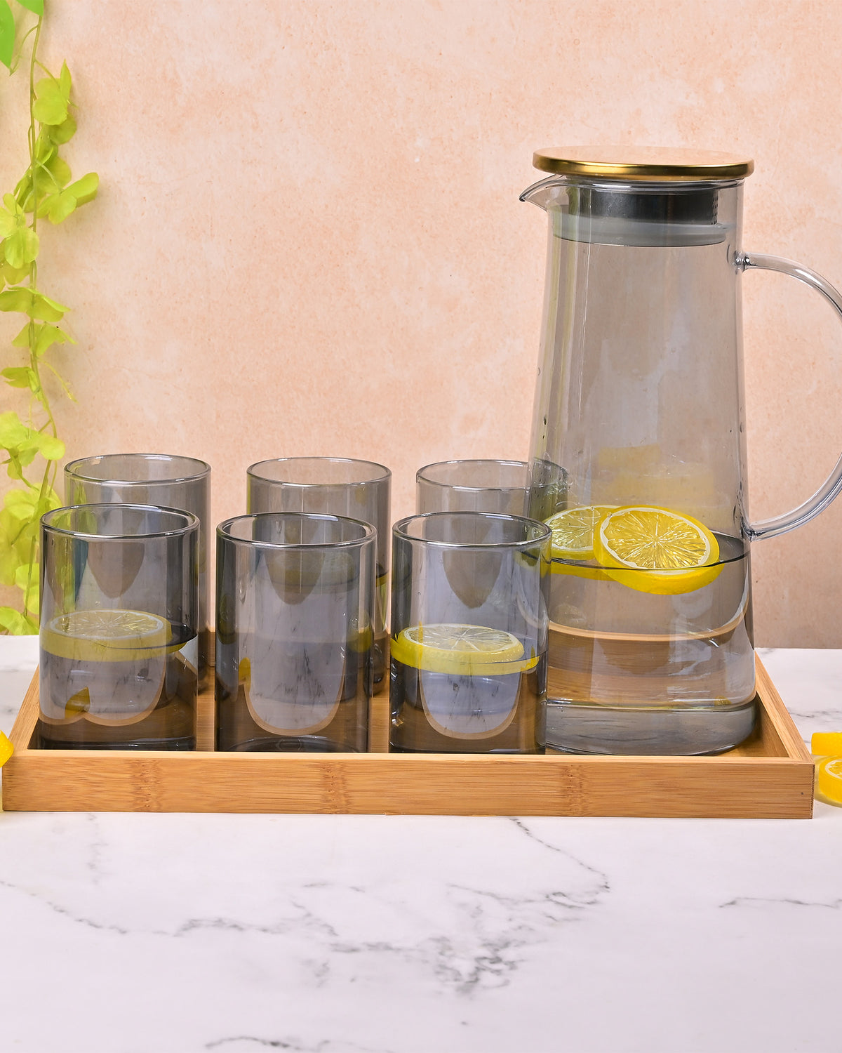 Classic glass carafe with elegant golden lid for stylish beverage serving