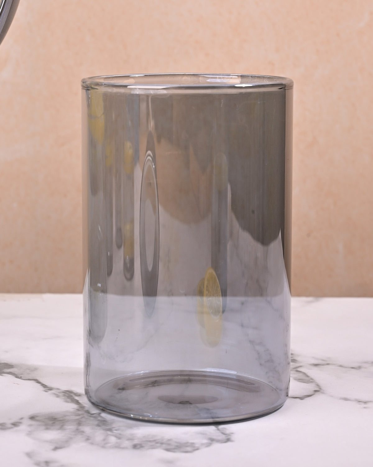 Decorative clear glass carafe with a luxurious golden lid