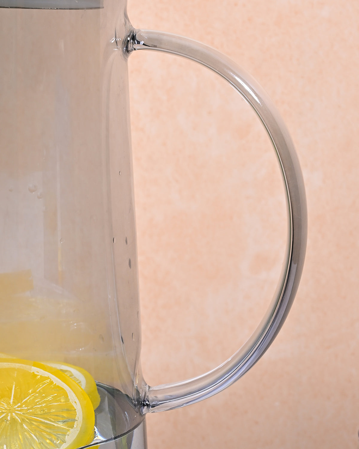 Contemporary glass carafe with golden lid for elegant table settings