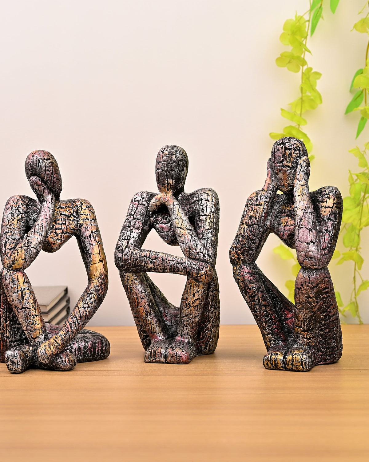 Copper Thinking Trios sculpture set with elegant figurine design