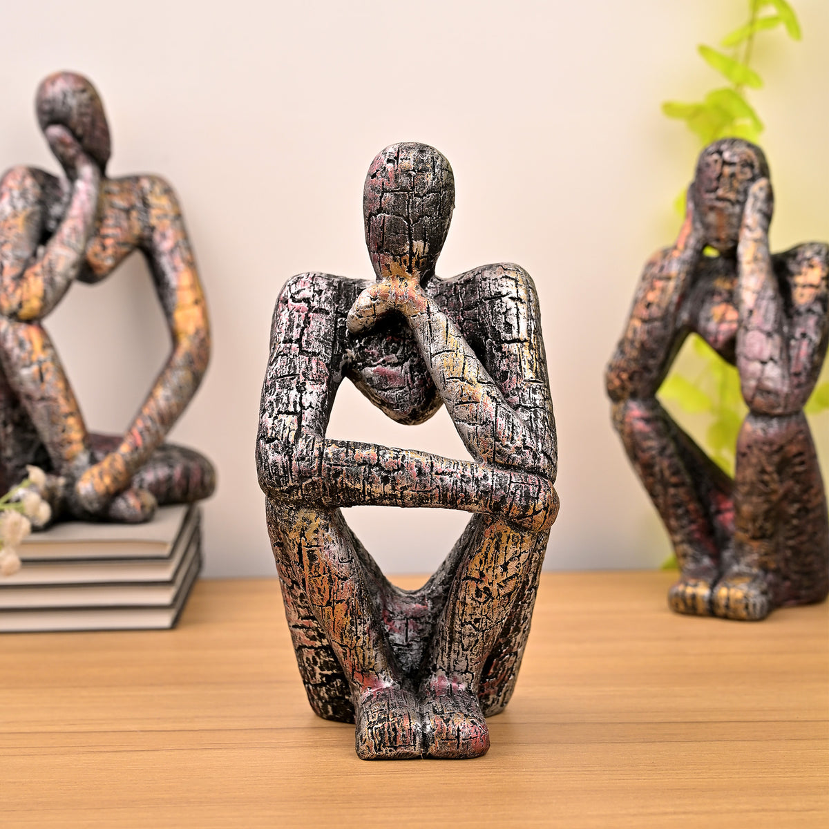 Copper Thinking Trios sculpture set displayed on a tabletop