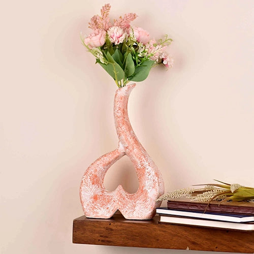 Coral and white ceramic vase with elegant decorative design
