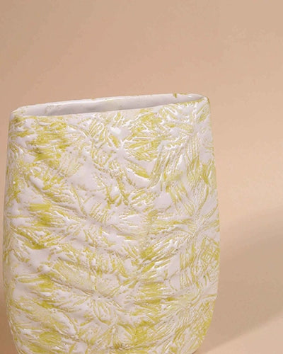 Textured cream vase with intricate botanical leaf detailing