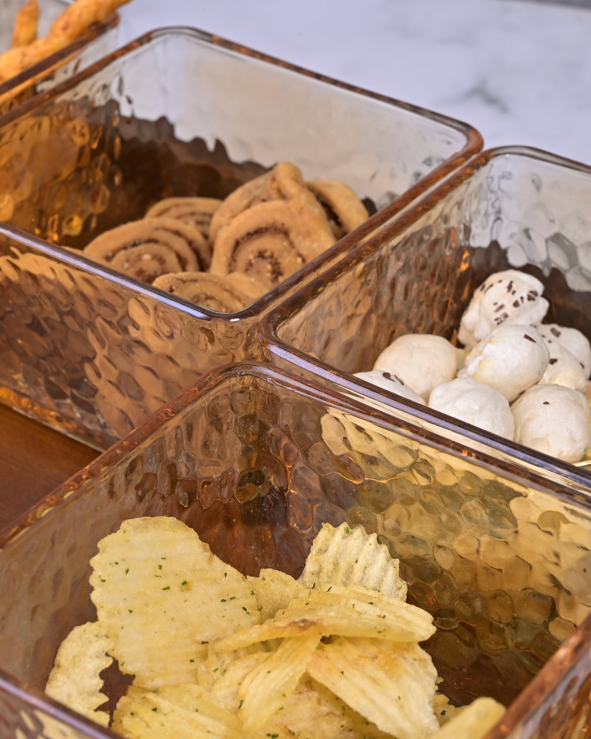 Dazzling glass bowls arranged on decorative tray