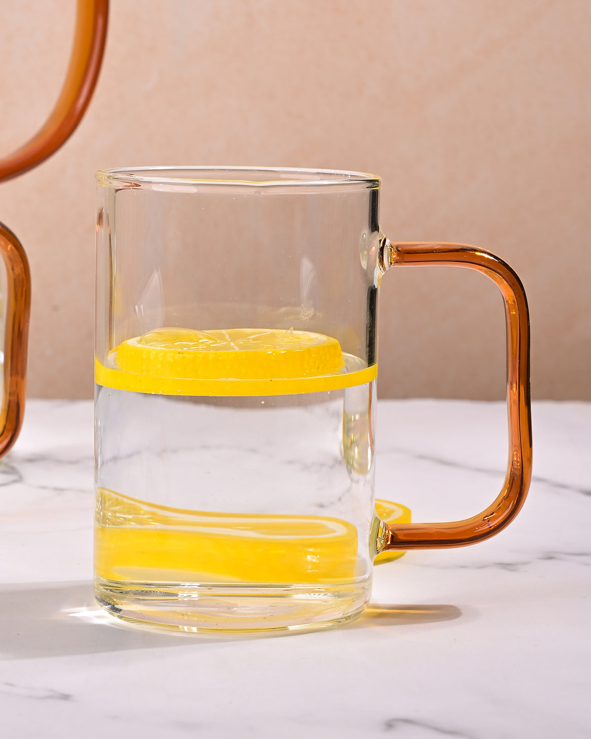 Decorative glass pitcher with matching mugs for kitchen use