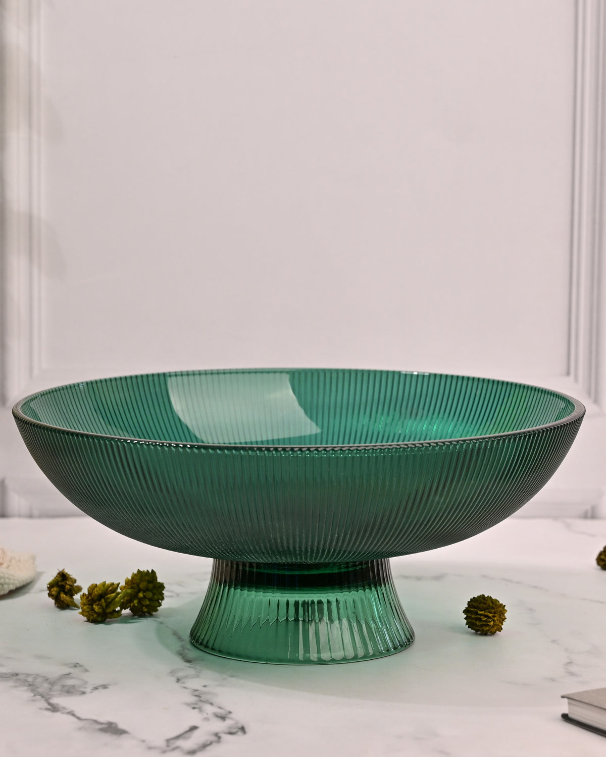 Elegant green glass fruit bowl with stylish design