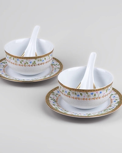 Decorative porcelain bowls with matching spoons for serving