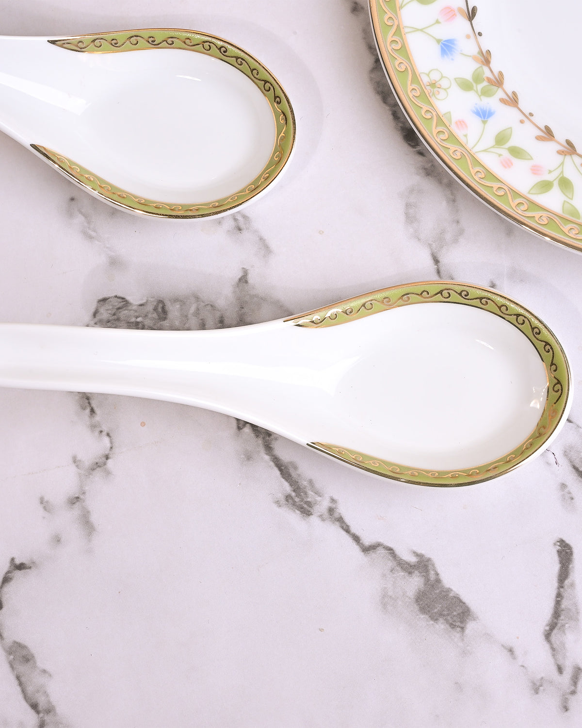 Set of two porcelain bowls with matching ceramic spoons