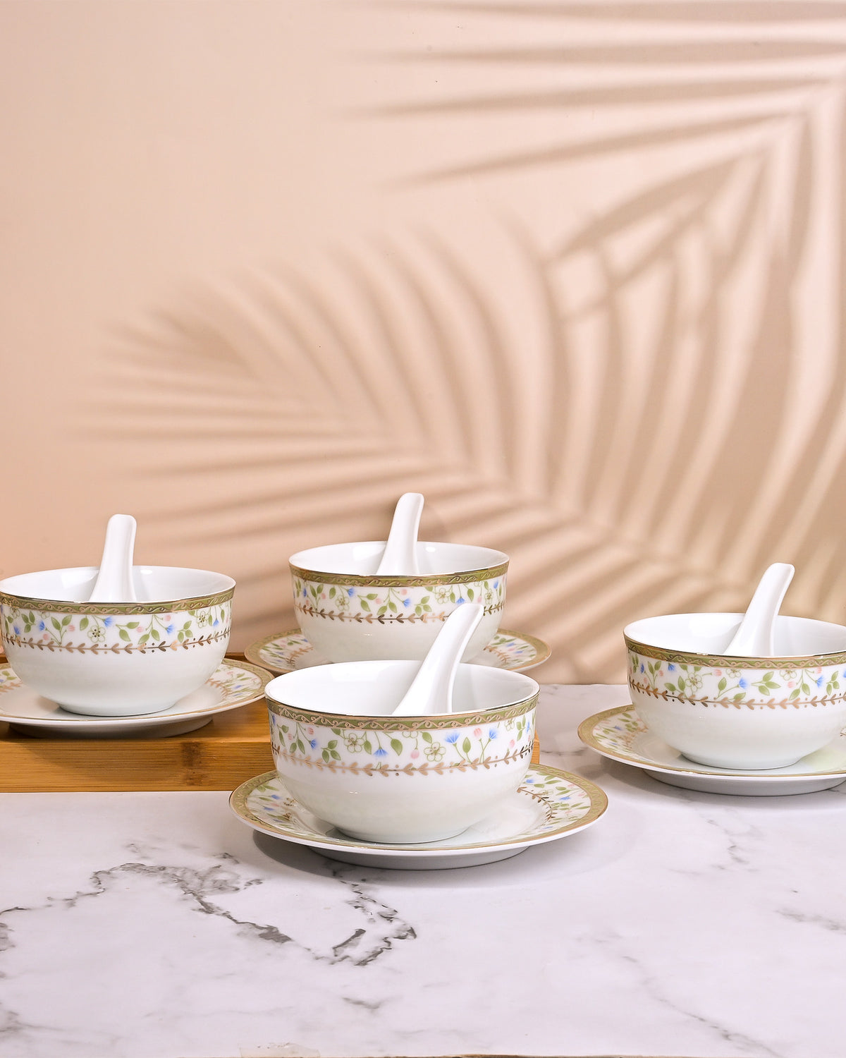 Set of 4 elegant porcelain bowls with spoons