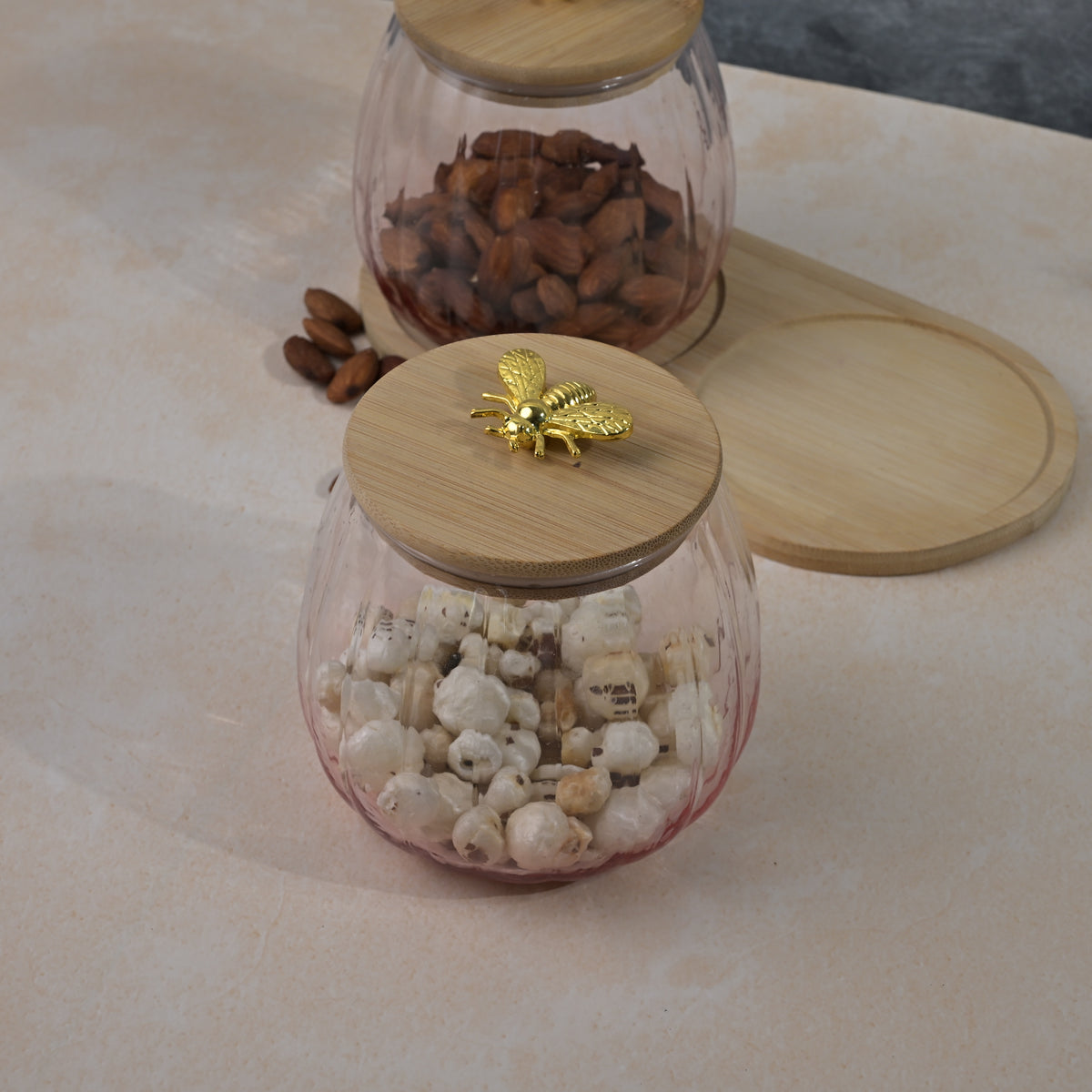 Clear glass jar with wooden cover for food storage