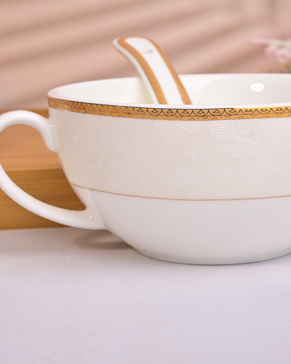 Minimalist white porcelain bowls and spoons for everyday dining