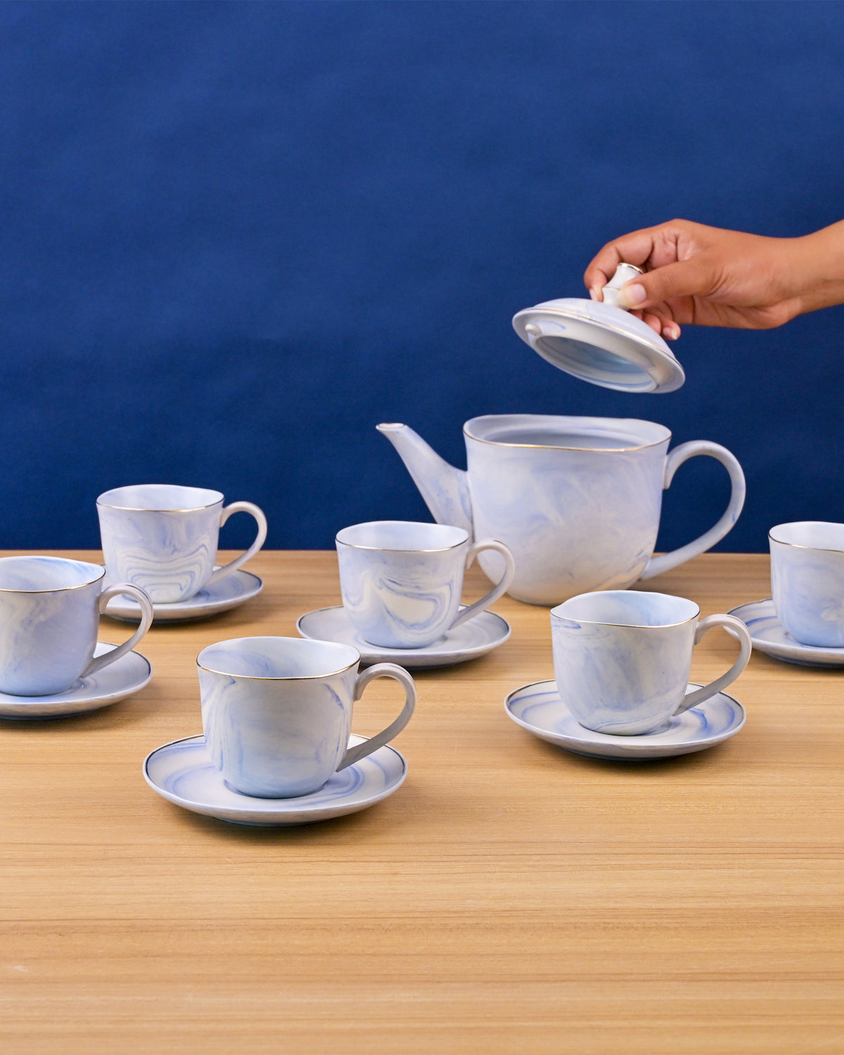 Sky blue tea kettle with cups