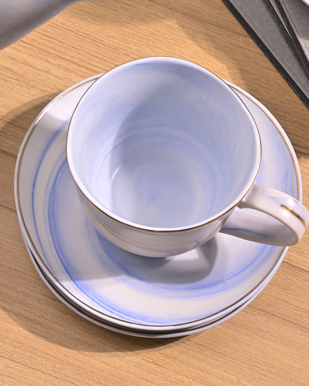 Sky blue tea kettle set on table