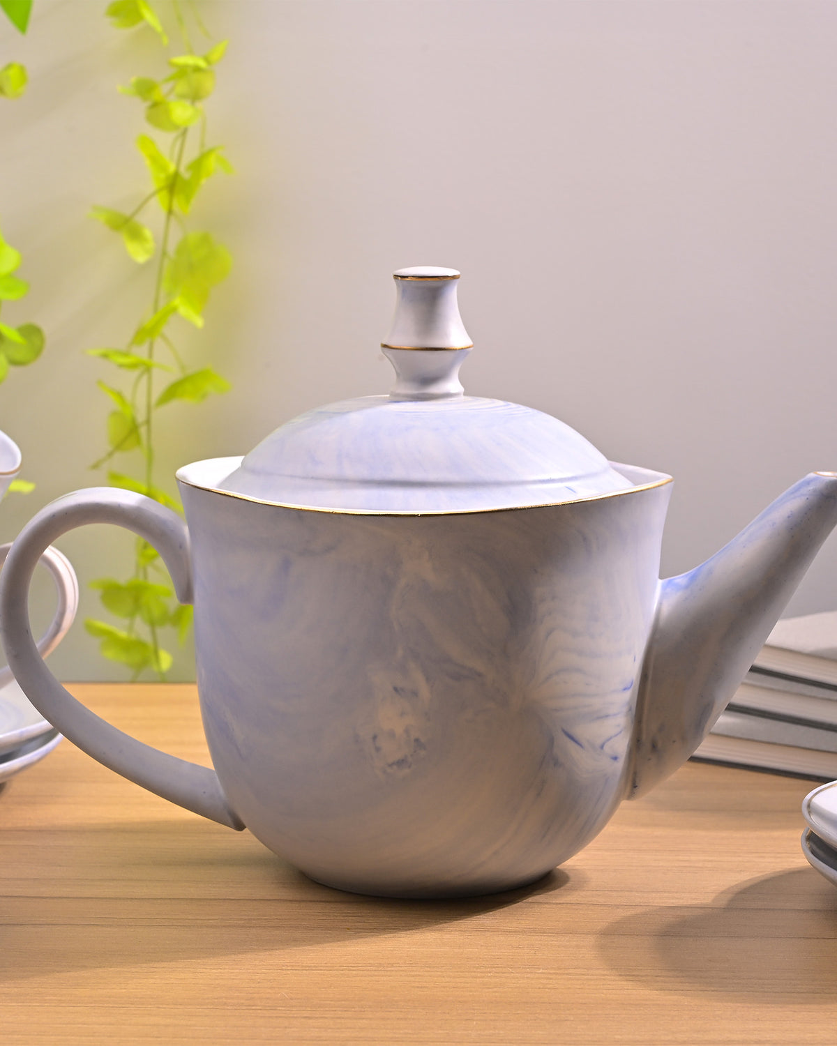 Blue tea kettle and teacup set
