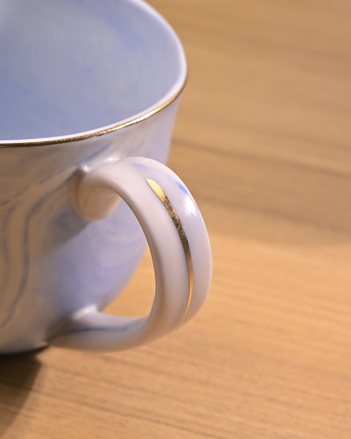 Faded blue tea kettle with cups