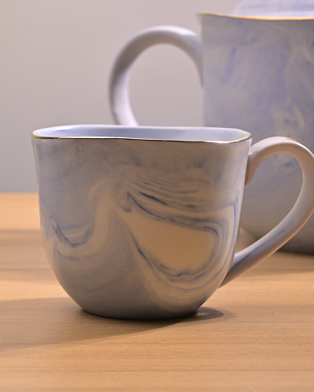 Decorative faded blue tea set
