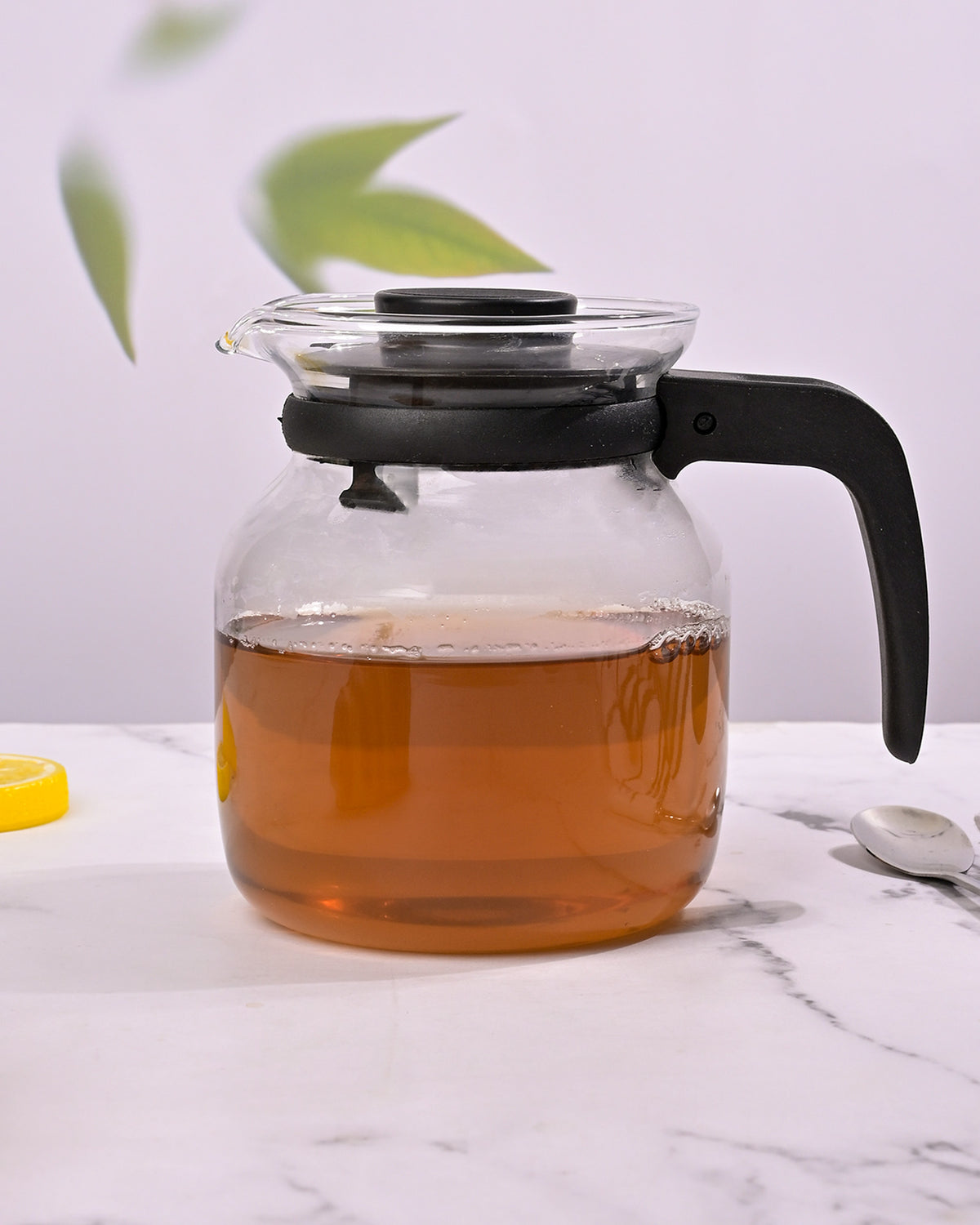 Glass tea pot with black handle