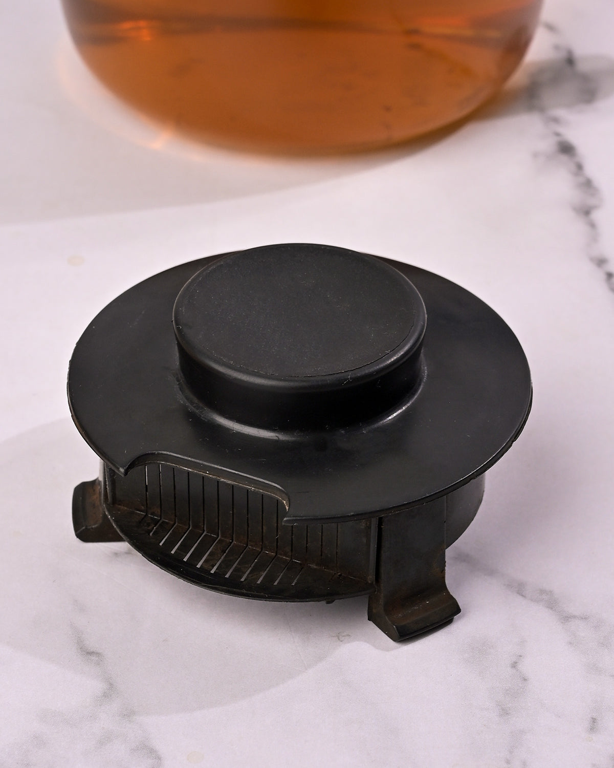Glass tea pot with sleek black grip