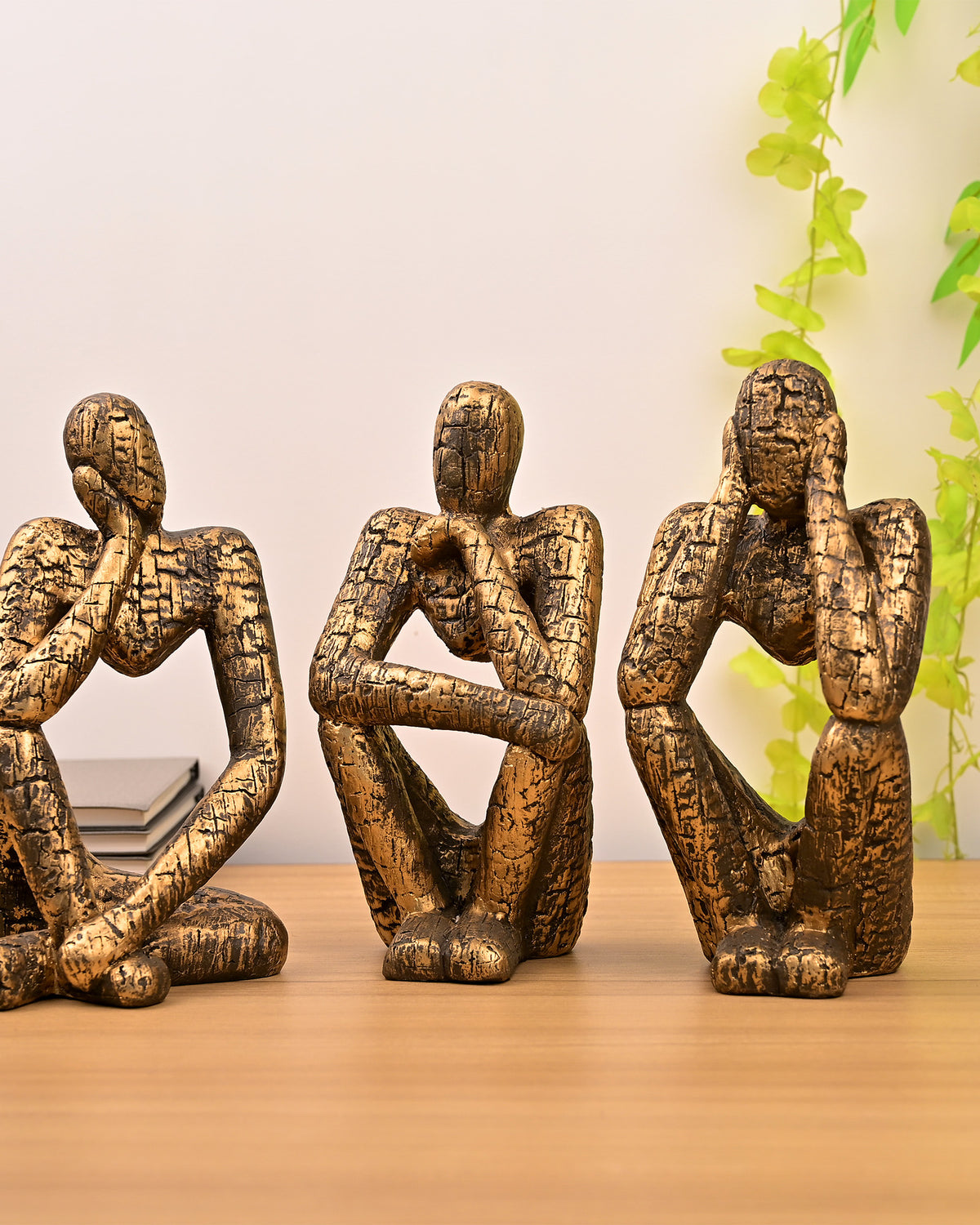 Gold Thinking Trios sculpture set with elegant figurine design