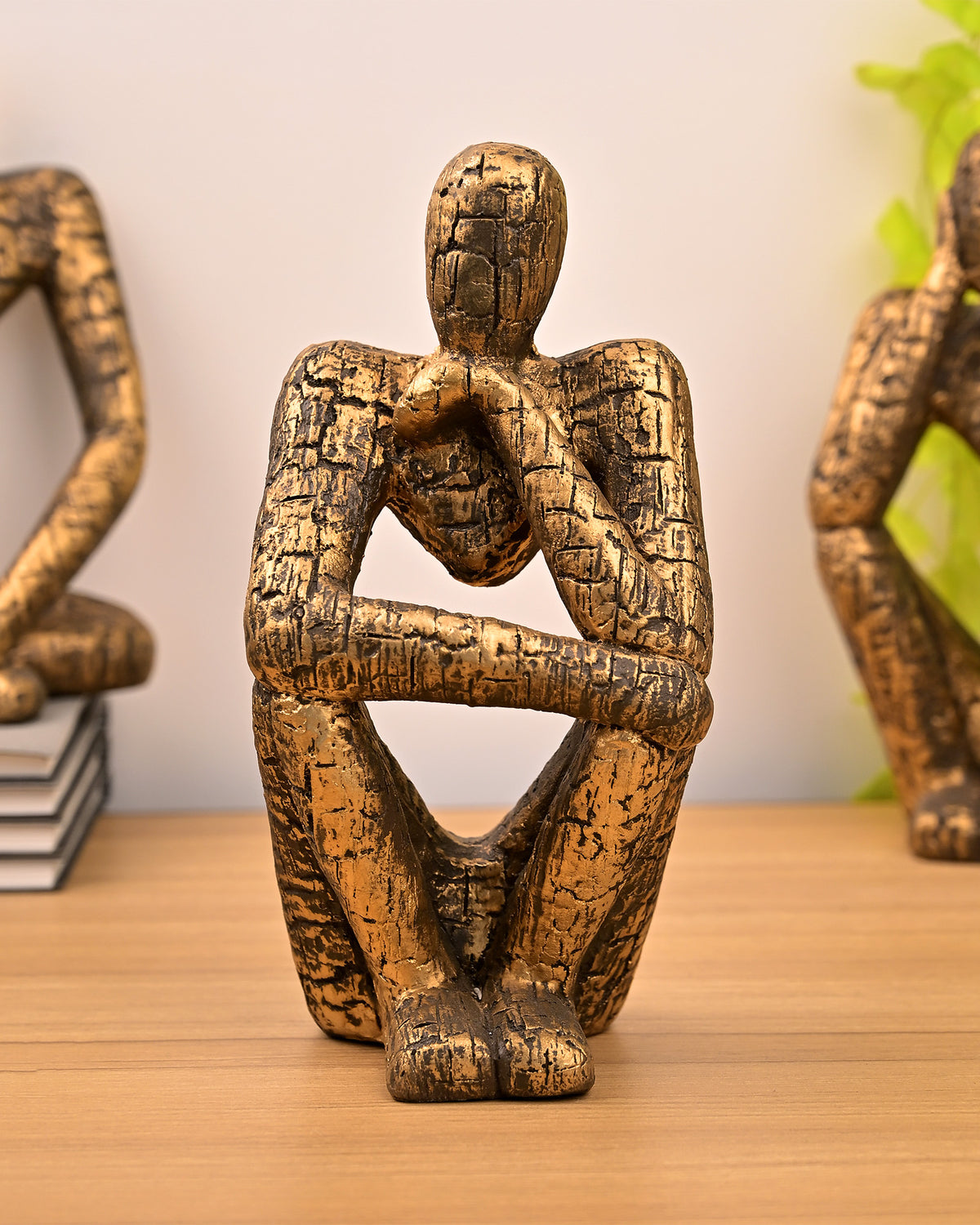 Gold thinking figures sculpture set for stylish interiors
