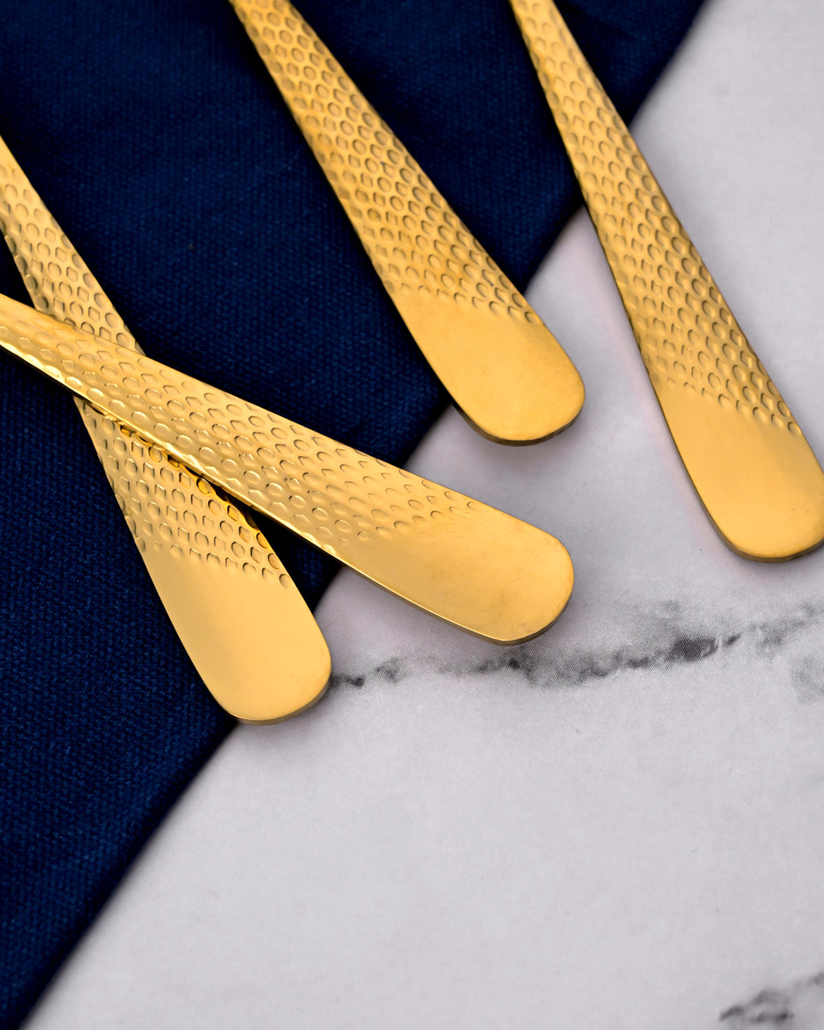 Elegant Gold Steel Spoons Featuring a Unique Hammered Design