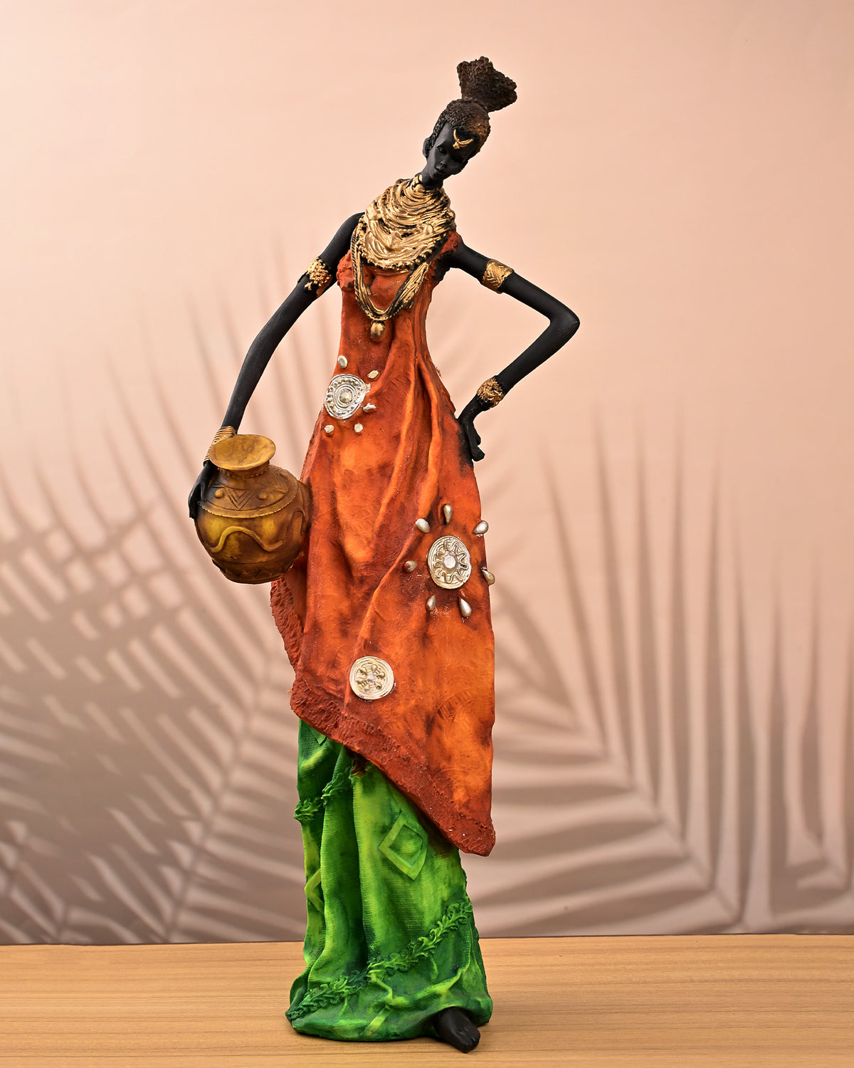 Golden ethnic woman statue with elegant traditional design