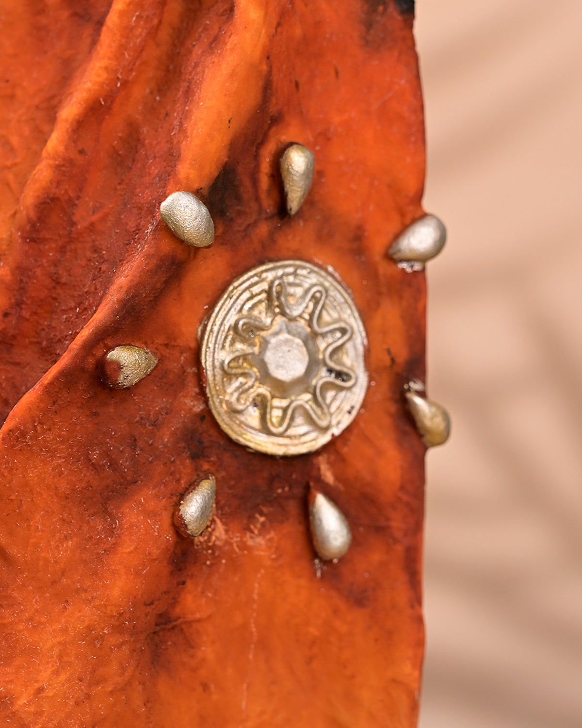 Golden female statue inspired by traditional attire