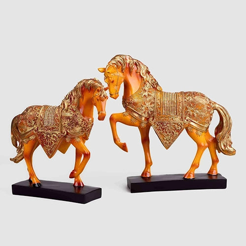 Golden horse duo figurines with elegant decorative design